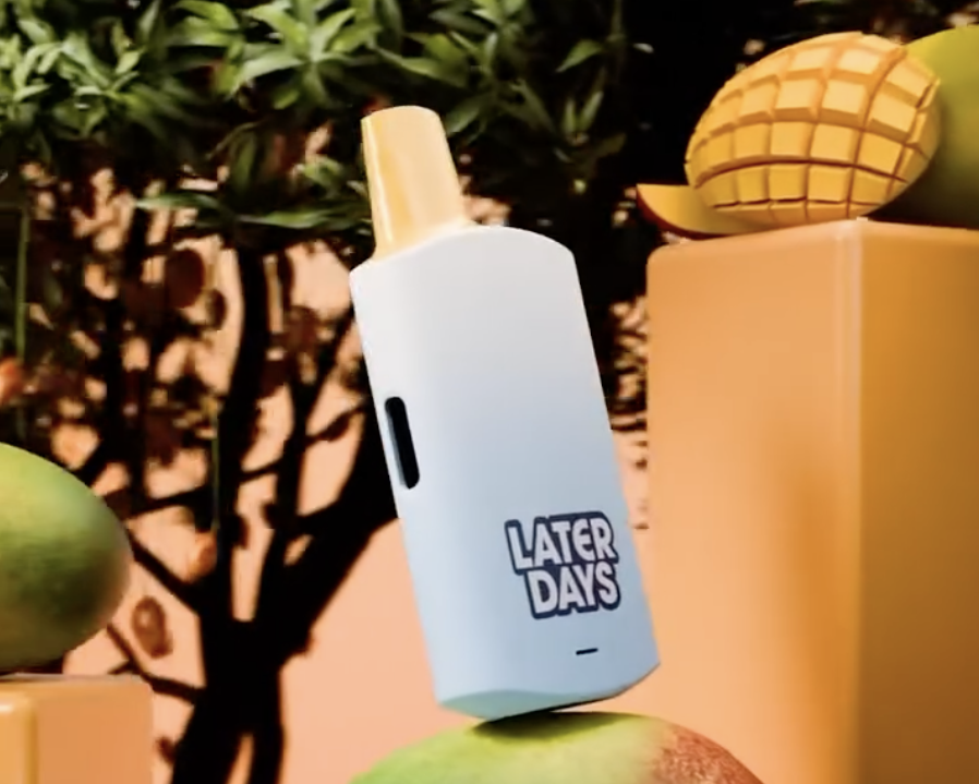 Later Days mango flavor disposable vape with sliced mango on an orange backdrop in NJ