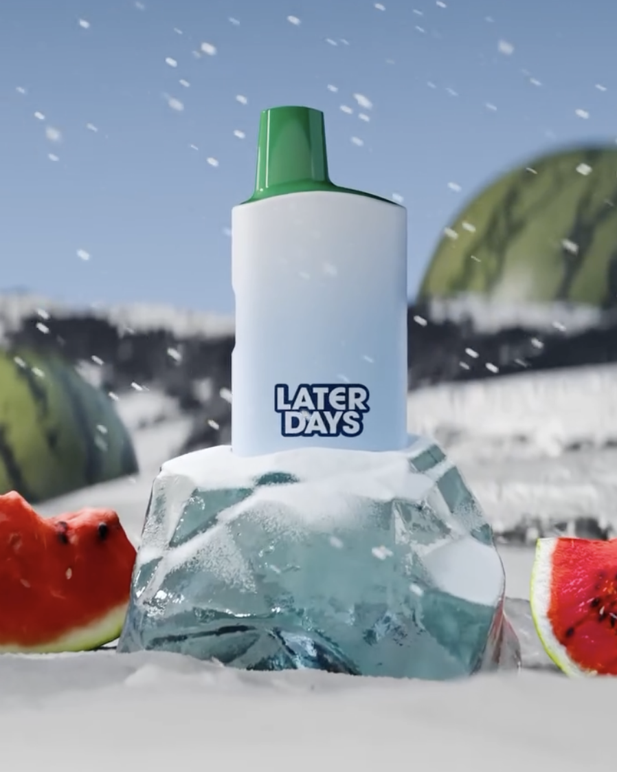 Later Days watermelon flavor vape balanced on a fresh watermelon slice in New Jersey
