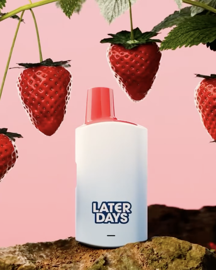 Days strawberry flavor vape surrounded by ripe strawberries on a pink background at Hashery NJ